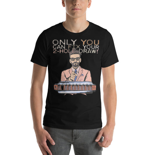A male model wearing the black version of the T-Shirt. The shirt reads, "Only YOU can fix your 2-hole draw!" Under this text is a man in sunglasses and a pink suit and tie, pointing forward, above a harmonica with a blank space in the 2-hole.