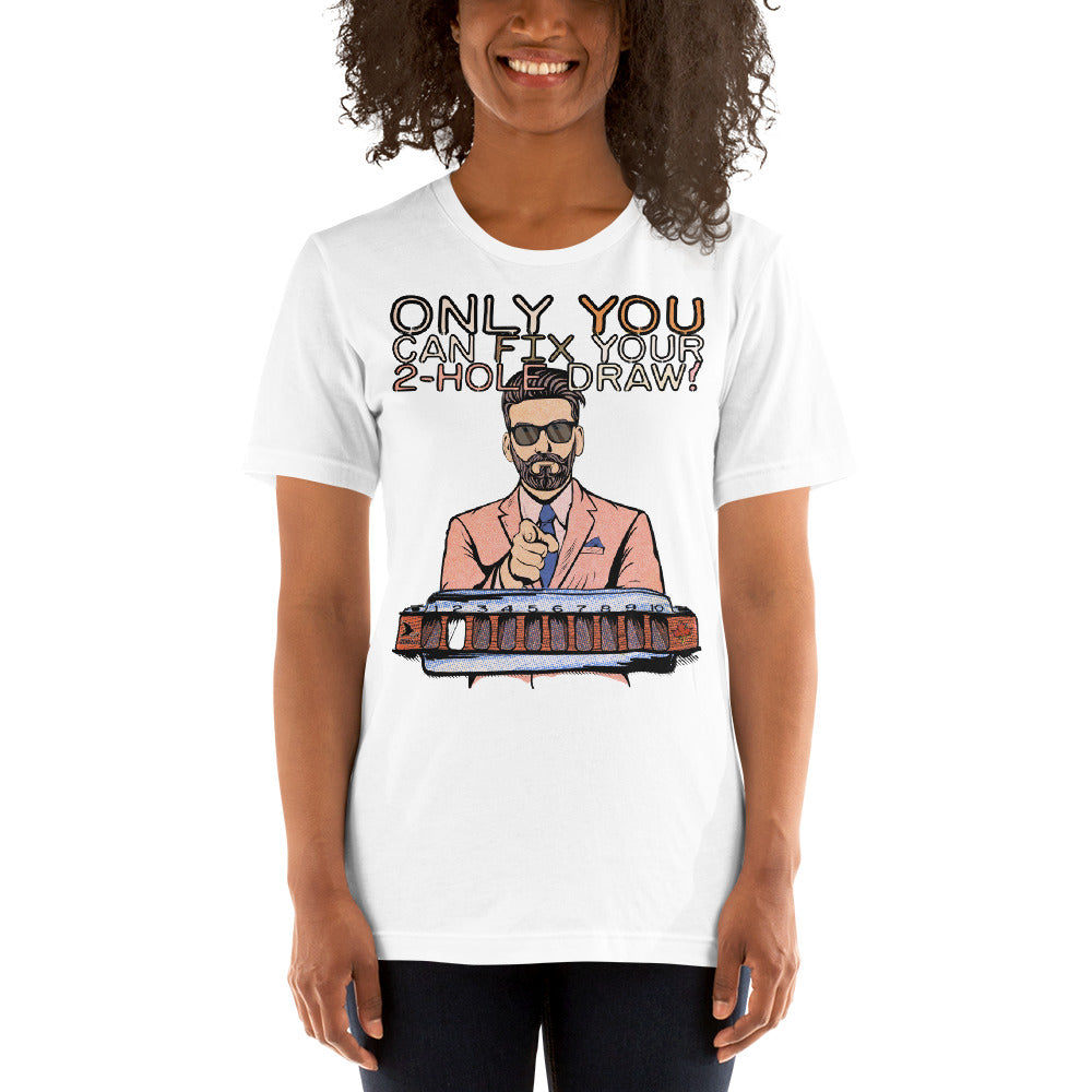 A female model wearing the white version of the T-Shirt. The shirt reads, "Only YOU can fix your 2-hole draw!" Under this text is a man in sunglasses and a pink suit and tie, pointing forward, above a harmonica with a blank white space in the 2-hole.