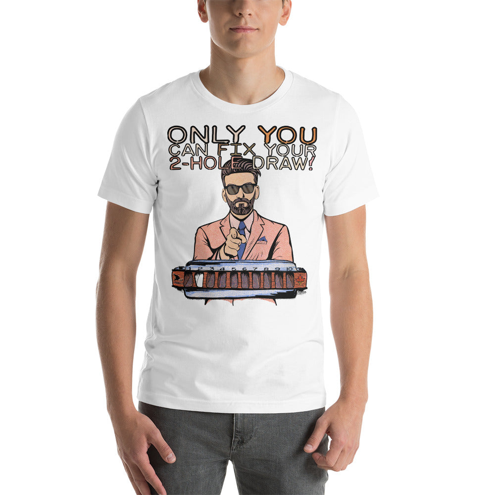 A male model wearing the white version of the T-Shirt. The shirt reads, "Only YOU can fix your 2-hole draw!" Under this text is a man in sunglasses and a pink suit and tie, pointing forward, above a harmonica with a blank space in the 2-hole.